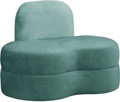 a large green couch sitting on top of a white floor