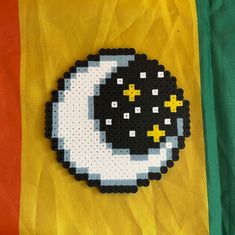 a black and white object with yellow stars on it's side next to a flag