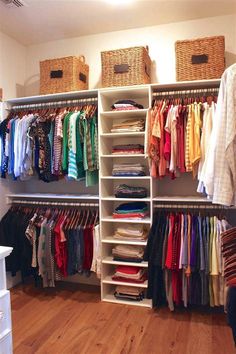 an organized closet with clothes and baskets