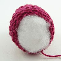 a ball of yarn is sitting on the floor with a string attached to it,