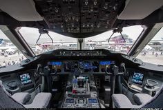 the cockpit of an airplane with multiple controls