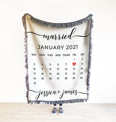 a personalized wedding date blanket hanging on a wall