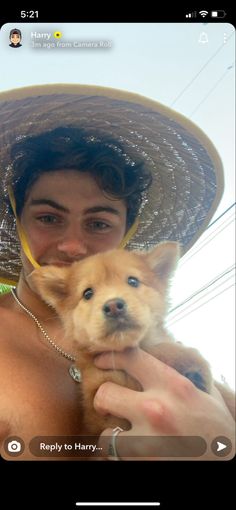 a woman in a straw hat holding a small dog with her face close to the camera