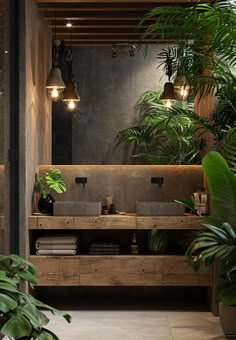 a bathroom with plants and lights above the sink, along with other potted plants