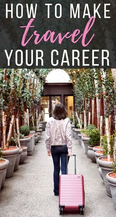 a woman with a pink suitcase is walking down the road in front of potted trees