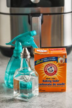 a bottle of baking soda next to an electric pressure cooker and carton of baking soda