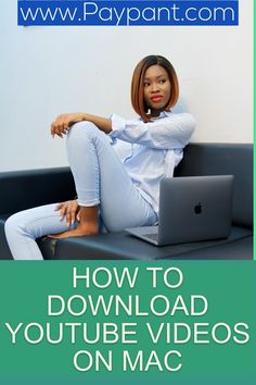 a woman sitting on top of a couch with a laptop computer in front of her