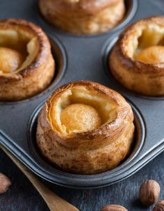 baked pastry in a muffin tin with almonds