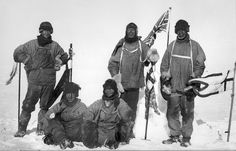 four men in ski gear posing for a photo