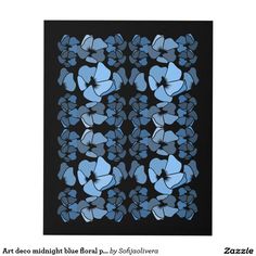 a black and blue pillow with flowers on it