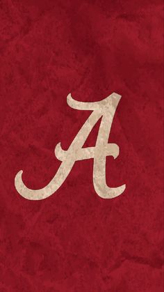 the university of alabama logo is shown on a red background with grungy paper