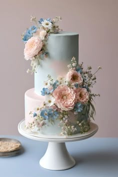 Baby blue and blush pink floral wedding cake    Baby blue wedding | pale blue wedding | blush pink wedding | dusty rose wedding | baby blue and blush pink wedding | blue and pink wedding | blue and pink wedding cake | floral wedding cake | spring wedding cake | pastel wedding cake | pink wedding cake | blue wedding cake Blue Rose Wedding Cake, Dusty Blue Boho Wedding Cake, Wedding Theme Pink And Blue, Wedding Cakes Pink And Blue, Light Blue And Pink Wedding Cake, Blush Blue And Green Wedding, Dusty Pink And Blue Wedding Theme, Dusty Blue And Peach Wedding Cake, Pastel Wedding Cake Ideas