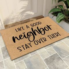 a door mat that says, like a good neighbor stay over there