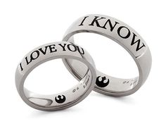 two wedding rings with i love you written on the sides and one saying i know