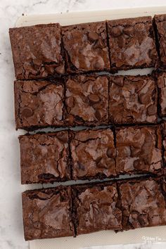 chocolate brownies cut into squares on a cutting board