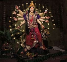 a statue of the hindu god rama with his arms spread out and hands outstretched in front of him