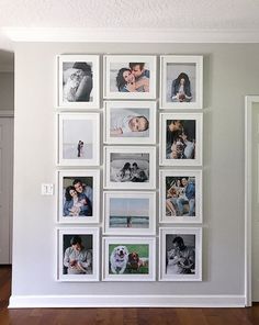 a white wall with many pictures on it and a wooden floor in front of it