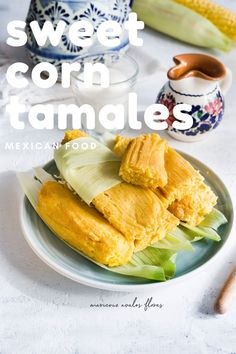 sweet corn tamales on a plate with mexican food