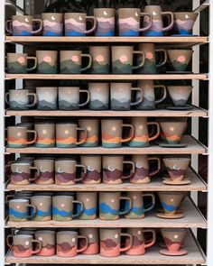 a shelf filled with lots of different colored mugs on top of eachother