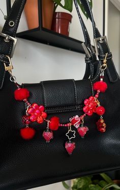 You don't need a new bag, you just need to charm! I created these chains to freshen up your old and new accessories, to personalize them and make them more unique to you!  Chain Length approx: 12" + 5 handmade charms Colors: red, gold, silver Materials, Metal, handcrafted beads, plastic beads Collection: Strawberry Dew  Bag chains are not meant to hold weight but to decorate your accessories Bead Bag Charm, Purse Charms Aesthetic, Bag Charms Diy, Diy Bag Charm, Bag With Charms, Strawberry Bag