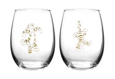 two wine glasses with winnie the pooh and tigger etched on each one side