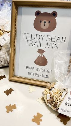 there is a teddy bear trail mix in front of a framed sign that says, teddy bear trail mix because you're so sweet, take home a treat