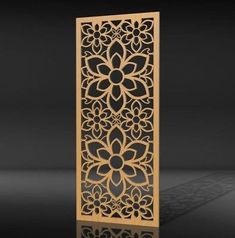 an intricate wooden panel with flowers and leaves is shown in the middle of a black background