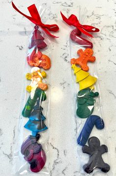 several plastic animal shaped candy bags with red ribbon on the top and one in the middle