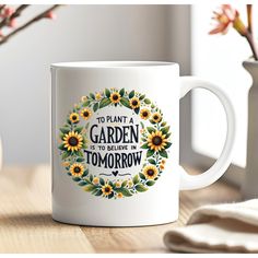 a coffee mug that says to plant a garden is to believe in tomorrow