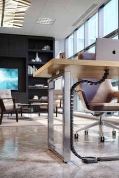 an apple computer sitting on top of a wooden table