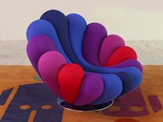 a colorful chair sitting on top of a wooden floor