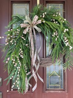 a wreath is hanging on the front door