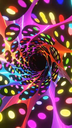 an image of colorful lights that look like they are going through a tunnel in the dark