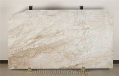 a large white marble slab on display in a room with no flooring or walls