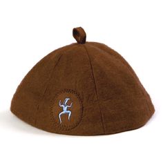 a brown hat with an antelope embroidered on it