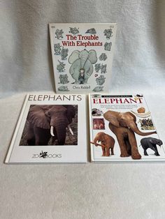 two books about elephants are sitting on a white sheet with an elephant in the background