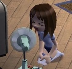 a cartoon character sitting on the ground next to a fan