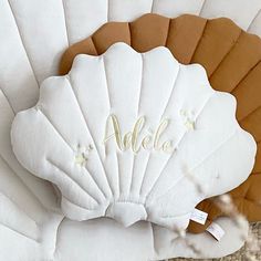 a close up of a decorative shell with the word adelo on it's side