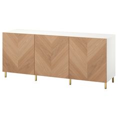 the sideboard is made out of wood and white with gold legs, it has two doors