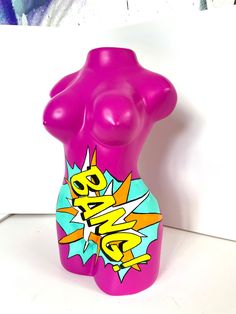 a pink sculpture with an abstract design on it's body and chest, against a white background