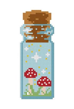 a cross stitch pattern with mushrooms in a jar