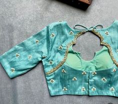 Hand embroidered ready made saree blouse / crop top/stitched saree blouse usa / turquoise blue saree blouse/ hand embroidered blouse/zardosi blouse/sea green saree blouse/ pure silk blouse/teal blue maggam work blouse        It is very true that a perfect blouse is the one which makes your saree look stand out !! If you find one of such a style that you have been wanting to have then dont let it go !! we carry such unique trending blouses that instantly add a stylish look to any saree !!     Well..!! we understand that you may not get in your desired size/pattern, here you go with customization according to your size/pattern which we can deliver in 1 week of time period !!      Here is a beautiful Hand embroidered saree blouse in light sea green color that has simple yet unique hand embroi Green Colour Blouse Designs, Work Designs For Blouses, Zardosi Blouse, Embroidery Blouse Saree, Hand Embroidery Blouse, Cut Work Blouse, Ready Made Blouse, Maggam Blouse, Blouse Works