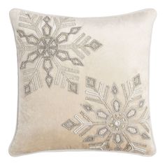 a white pillow with snowflakes on it