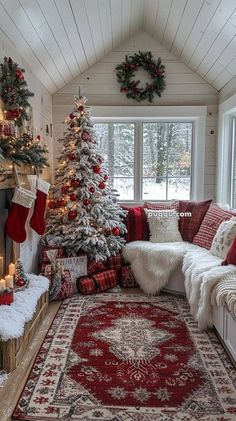 a living room decorated for christmas with red and white decorations on the tree, stockings, pillows, rugs and fireplace