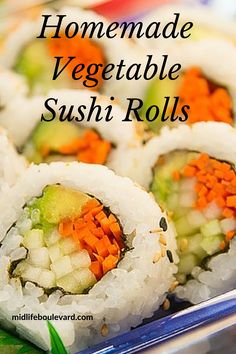 some sushi rolls with carrots and celery on them in a plate