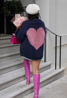 Layer up with love thanks to this hand knit chunky cardigan boasting a giant red heart on the back. Dress this design up with one of our beautiful mini skirts or keep it super casual with jeans.    Handmade knit  Open front  Heart shape pattern on back  Balloon sleeves  Knit fabric provides flexibility  Not lined  100% Acrylic  Hand wash cold      size & fit    CM IN          Size  Length  Bust  Waist  Shoulder  Sleeves      XXS-XS  61  106  Free  42  64      S-M  62  110  Free  44  65      L-XL Led Dress, Handmade Knit, Fashion Buyer, Heart Hands, Chunky Cardigan, Key To My Heart, Indie Design, Back Dress, Heart On