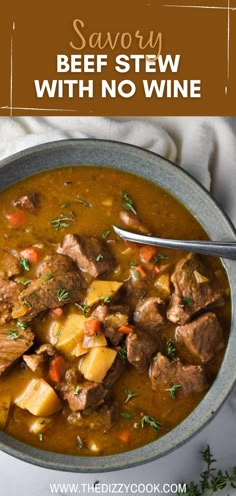 a bowl of beef stew with potatoes and carrots in it, on top of a white cloth