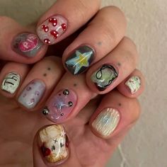 a woman's hand with different nail designs on it and one has a star