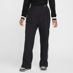 An asymmetrical waist and sporty white piping refresh the timeless style of these easy-fitting, woven trousers. Plus, a water-repellent finish helps keep you dry no matter where your day takes you. Functional Bottoms With Elastic Side Panels, Athleisure Sports Bottoms With Contrast Trim, Sports Athleisure Bottoms With Contrast Trim, Nike Nylon Athleisure Pants, Black Activewear With Contrast Trim, Sporty Nike Nylon Pants, Nike Sporty Nylon Pants, Sportswear Collection, Cold Hands