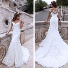 a woman in a white wedding dress standing next to a stone wall